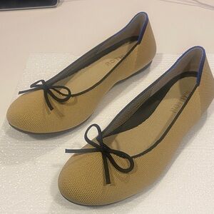 Rothy's Camel Flats with Black Bow and Blue Trim